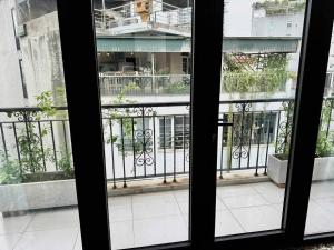 a view of a balcony from a window at Eco Nest Residence in Hanoi