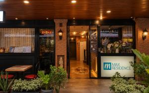 an entrance to a flower shop with a sign on the door at Max Residence in Pattaya