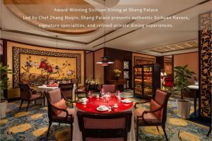 a dining room with a red table and chairs at Shangri-La Chengdu in Chengdu