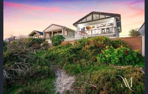 a house on top of a hill at Gate Access to the Beach in Edithvale