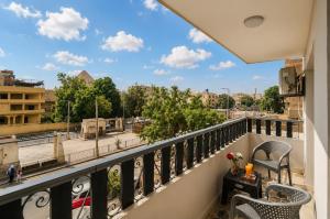 a balcony with a view of a city at Golden RZ pyramids view in Cairo