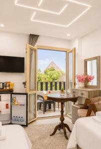 a hotel room with a view of the pyramids at Golden RZ pyramids view in Cairo