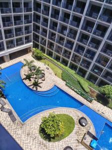 an overhead view of a pool in front of a large building at VP luxury moa staycation in Manila
