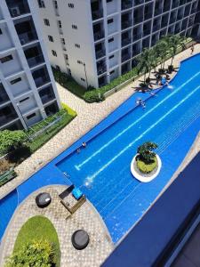 an overhead view of a swimming pool in a building at VP luxury moa staycation in Manila