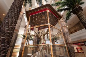 a display in a building with a statue of a tree at Holiday World Polynesia, Affiliated by Meliá in Benalmádena +51 photos