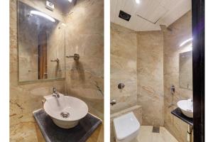 two pictures of a bathroom with a sink and a toilet at Hotel Omega in Mumbai +2 photos