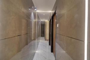 a hallway of a building with at Hotel Omega in Mumbai
