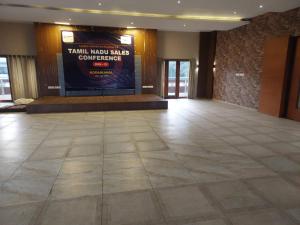 a large lobby with a large poster on the wall at Hotel Dreamland in Kodaikānāl