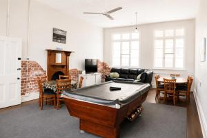 a living room with a ping pong table in it at Geraldton Shoreline Lodge in Geraldton