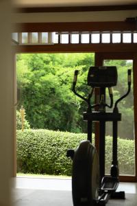 a exercise bike in front of a window at Pa Sak Tong in Chiang Rai