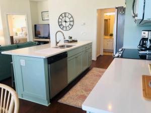 a kitchen with a sink and a counter top at Holden Hideaway condo in Supply