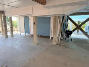 a house under construction with a camera in a room at Majak Moments in Holden Beach
