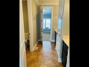 a hallway with a door leading to a bathroom at 287 OBW home in Holden Beach