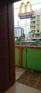 an open door to a restaurant with a mcdonalds sign at Central View Apartelle in Angeles