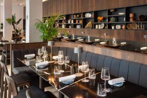 a dining room with a table and chairs at Meliá Luxembourg in Luxembourg