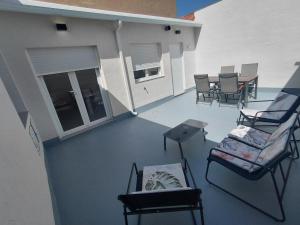 a view of a patio with chairs and a table at Corvera Guss in Corvera