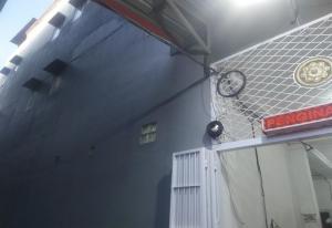 a blue building with a sign on the side of it at Hotel O Wisma Fortuner in Makassar +16 photos
