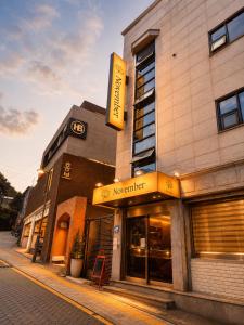 a building with a sign on the side of it at November Myeongdong in Seoul