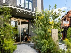 a bike parked outside of a hotel and lounge at Nagi Kurashiki Hotel&Lounge in Kurashiki