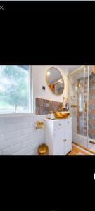 a white bathroom with a sink and a mirror at Agroturystyka u Kozdryka in Leśna +128 photos