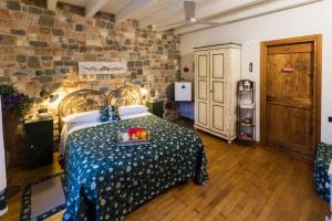 a bedroom with a bed with a tray of fruit on it at B&B La Casa Di Campagna in Bergamo