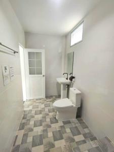 a bathroom with a toilet and a sink at Koh Tao Townhouse in Ko Tao +82 photos