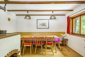 a dining room with a table and chairs at Haus Winterstaude in Egg