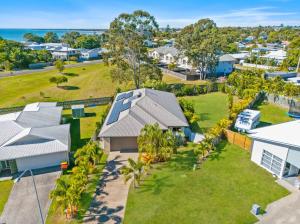 an aerial view of a house with a yard at The Seahaven - Modern 5 Bedroom Family Home Close to Beach in Pialba