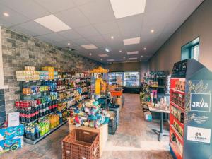 a store aisle of a grocery store with products at Charming Chalet Near Efteling in Kaatsheuvel