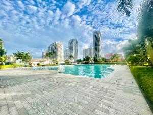 a swimming pool in a city with tall buildings at U Mall Condo in Sihanoukville