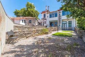 a bench in front of a building at GuestReady - Porto Home GuestHouse in Porto