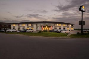 a large building with cars parked in front of it at Days Inn by Wyndham York in York