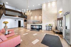 a living room with a couch and a fireplace at Days Inn by Wyndham York in York