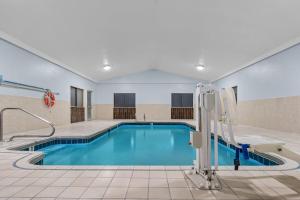 a pool with blue water in a hotel room at Days Inn by Wyndham York in York