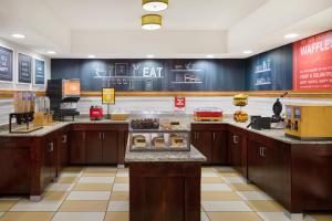 a fast food counter in a restaurant with at Hampton Inn Lawrence in Lawrence