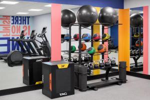 a gym with a bunch of balls and weights at Hampton Inn Lawrence in Lawrence