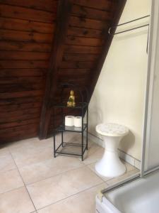 a bathroom with a toilet and a sink at Joyosada - Ferienhäuser in Seenlandschaft in Prusim +19 photos