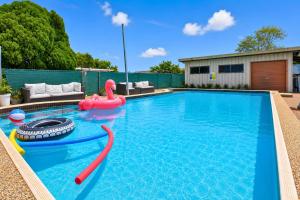 a swimming pool with a pool noodle in the middle of it at Coal d' Vine VIEW - Cessnock NSW in Cessnock