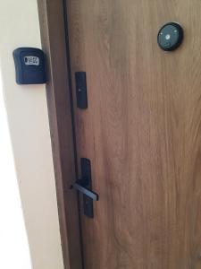 a close up of a wooden door at Kawalerka w kamienicy in Suwałki +5 photos