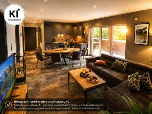 a living room with a couch and a table at Eastside Braunlage in Braunlage