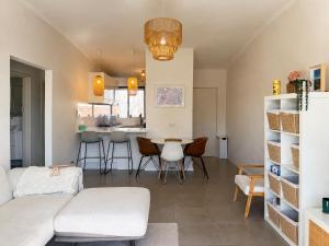 a living room with a couch and a table at Ocean Eye in Perth