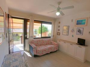 a living room with a couch and a window at Ammiraglio in Campese