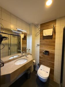 a bathroom with a sink and a toilet at Nomade Old City Hotel in Istanbul +68 photos
