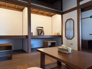 a room with a table and a mirror at Machiya Posong in Taitung City +62 photos