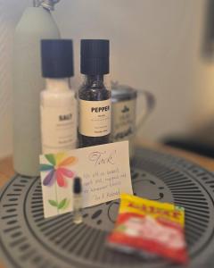 a bottle of ink and a sign on top of a fan at Small cozy basement apartment in Sundsvall