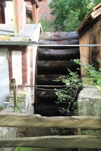 a spiral staircase leading up to a building at Ferienwohnung Mühlradblick in Geismar
