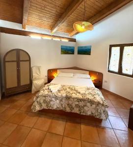 a bedroom with a large bed in a room at Casa Vacanza Villa Aurora in Laureana Cilento +111 photos