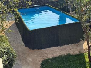 an overhead view of a swimming pool behind a fence at Lutzin Etxea, Caserío Vasco con piscina, jardín y parking, a 15 min de Bilbao in Llodio