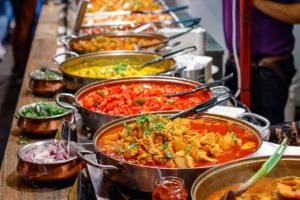 a buffet line with many different types of food at FabHotel Maple Leaf in Hyderabad