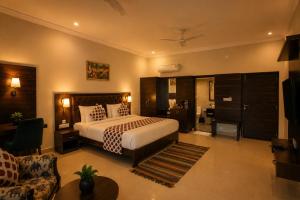 a bedroom with a bed and a living room at Jal Dhara Resort in Kumbhalgarh +70 photos